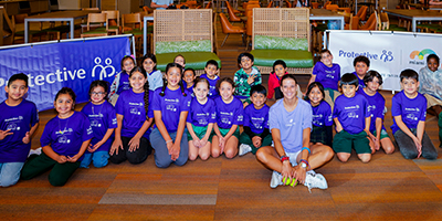 Emiliana Arango with children at an Amigos For Kids event.