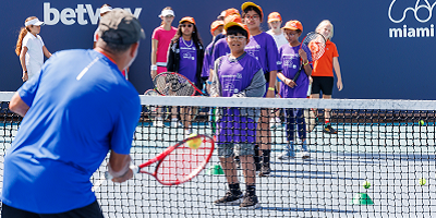 Amigos for Kids participants playing tennis