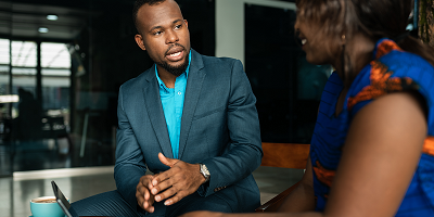 Businessman giving advice to young professional woman