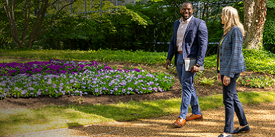 Protective teammates walking outside office