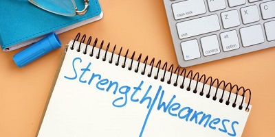 Notebook with list of strengths and weaknesses