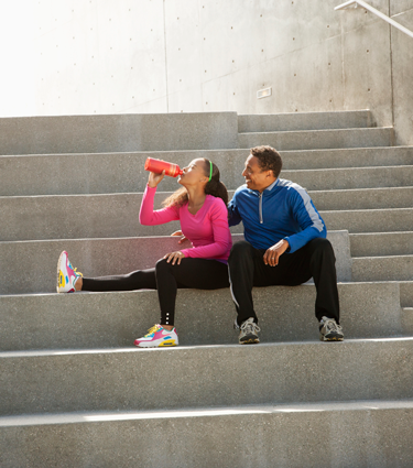 Father and daughter exercising together to improve their health. 