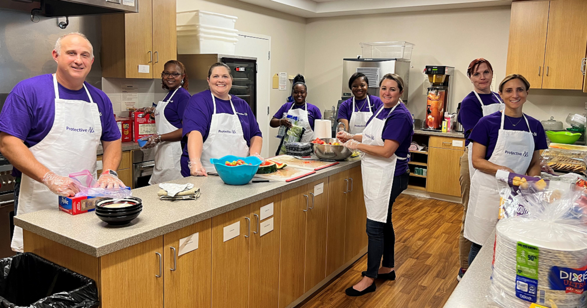 Protective Birmingham teammates volunteering in the kitchen at Ronald McDonald House Charities