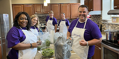 Protective St. Louis teammates volunteering in the kitchen at Ronald McDonald House Charities