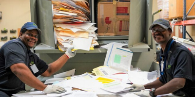 A group from United Ability working in the Protective Life mail room. 