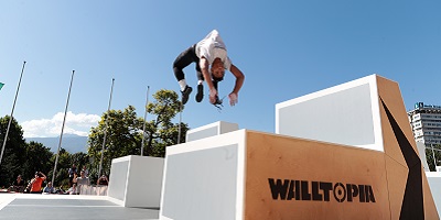 Miranda flipping over box in parkour event
